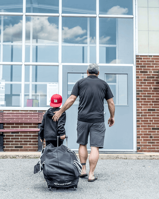 Father and Son entering Hockey Rink for Practice