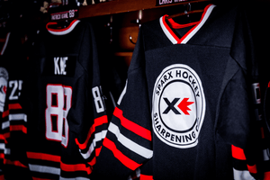 Two Sparx Hockey Jerseys with one Having Patrick Kane on the name on the back of the jersey